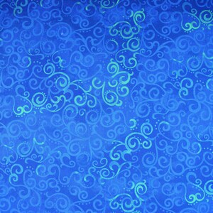 May include: A vibrant blue fabric with a repeating pattern of swirling, scroll-like designs in varying shades of blue and teal. The fabric has a textured appearance, suggesting a woven material.