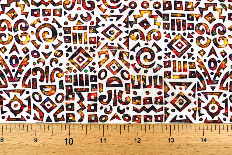 May include: A white fabric with a repeating pattern of colorful geometric shapes. The shapes are outlined in black and filled with shades of red, orange, yellow, green, blue, and purple. The fabric is textured and has a slightly distressed look.
