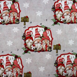 May include: A festive fabric featuring a repeating pattern of three gnomes singing in a choir. The gnomes are wearing red and white hats and have white beards. The fabric has a gray background with white snowflakes and musical notes.