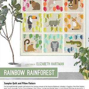 May include: A colourful quilt pattern featuring nine animal blocks inspired by the Amazon Rainforest. The pattern includes a capybara, pink river dolphin, sloth, jaguar, armadillo, toucan, squirrel monkey, tapir, caiman, and morpho butterfly. The quilt pattern is titled "Rainbow Rainforest" by Elizabeth Hartman.