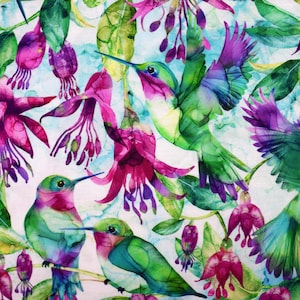 May include: A colourful watercolour design showcasing hummingbirds and fuchsia flowers. The birds are in shades of green, purple, and blue, with long beaks and outstretched wings. The flowers are a deep pink and purple, with green leaves.