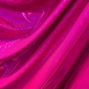 Hologram metallic dots hot pink fushia nylon spandex 4way stretch 58/60" Sold by the YD. Ships worldwide from Los Angeles California USA