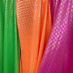 Sirena design with Iridescent foil hologram mermaid nylon spandex 4-way stretch 58/60” Sold by the YD. Ships worldwide from Los Angeles CA.