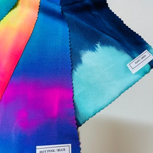 May include: Four fabric swatches with tie-dye patterns in different color combinations. The swatches are labeled "HOT PINK/BLUE", "NAVY/GREEN", and two others with unreadable text.