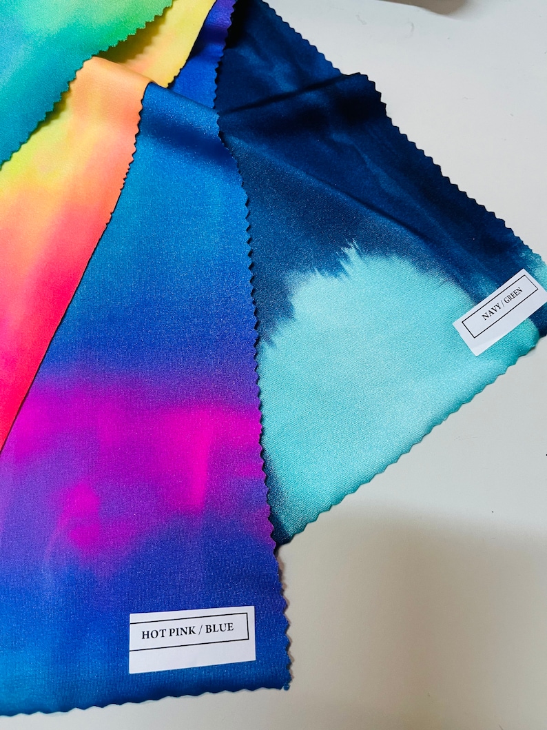 May include: Four fabric swatches with tie-dye patterns in different color combinations. The swatches are labeled "HOT PINK/BLUE", "NAVY/GREEN", and two others with unreadable text.