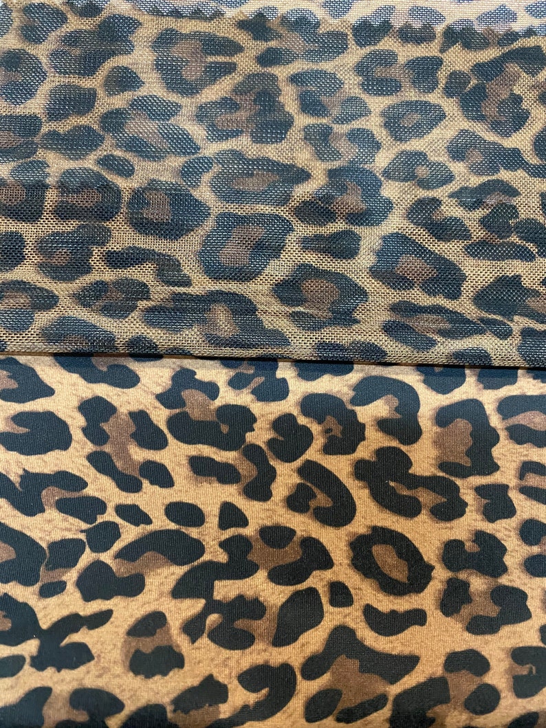 May include: A close-up of two pieces of fabric with a leopard print pattern. The top piece is a sheer mesh fabric, while the bottom piece is a solid fabric.