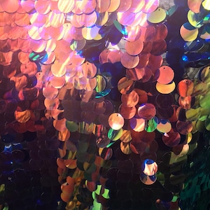 New Iridescent gold rose with zafiro blue 3 tone paillette sequins 20mm on stretch mesh 58/60" Sold by the YD. Ships worldwide from L.A CA