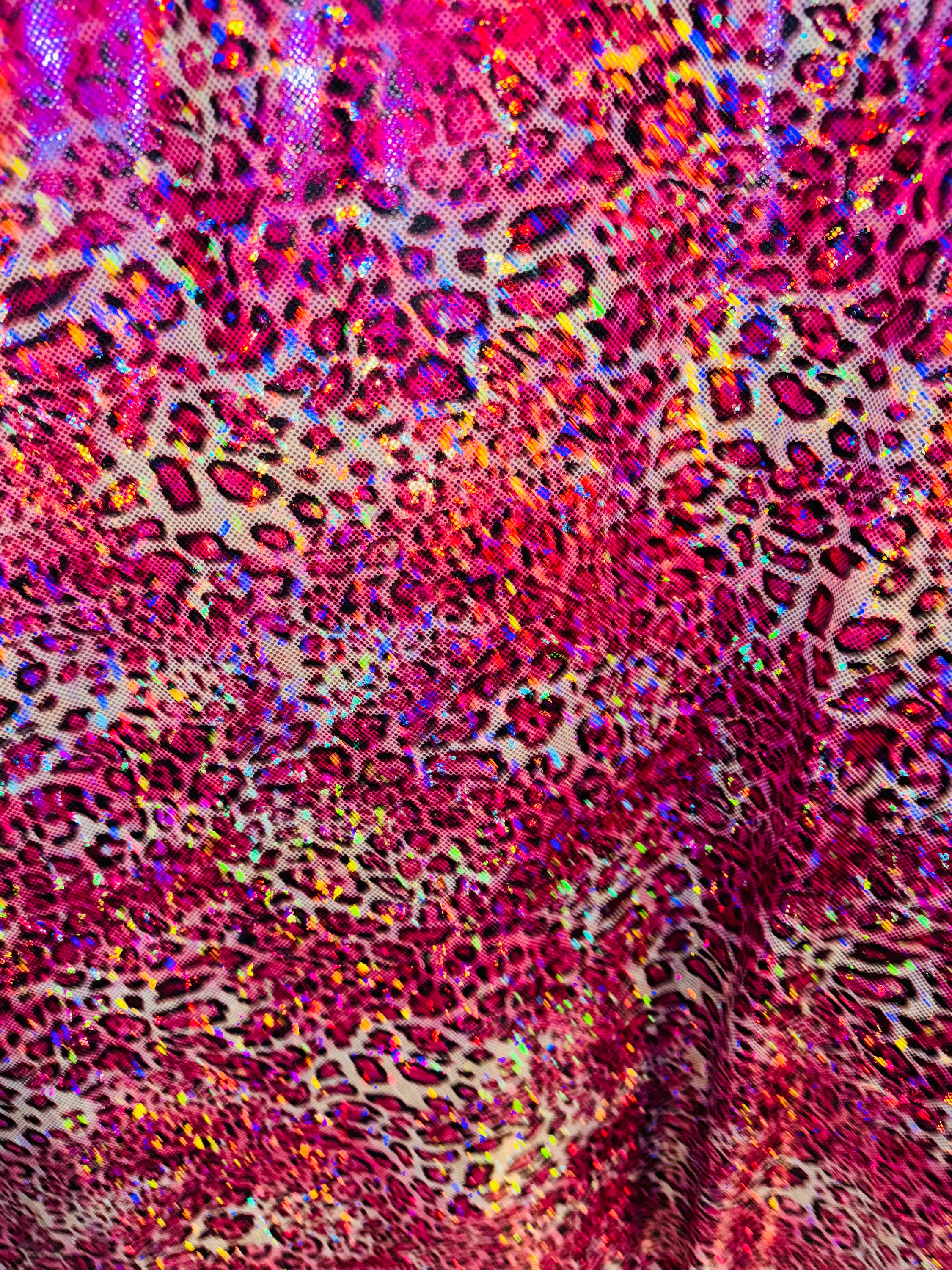 New Wild Leopard design on Hologram metallic nylon spandex 4-way stretch 58/60” Sold by the YD. Ships worldwide from Los Angeles CA