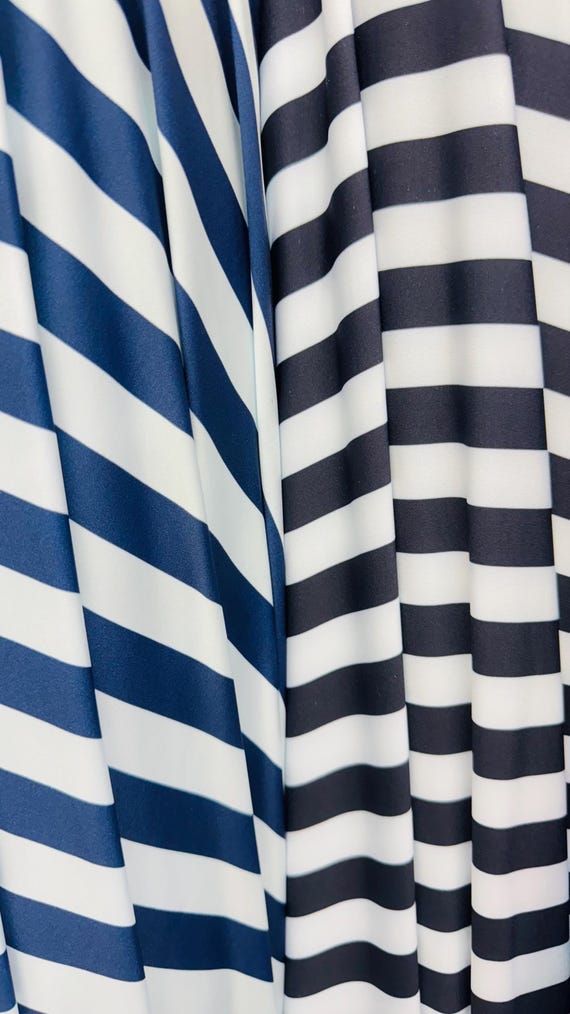 Stripe design print on nylon spandex 4way stretch 58/60" sold by the yd. Ships worldwide from Los Angeles California USA.