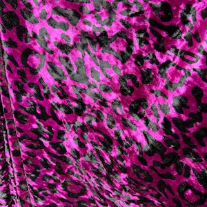 New Leopard design Magenta/Black exotic animal print on 4-way stretch velvet 58/60” Sold by the YD. Ships worldwide from Los Angeles CA