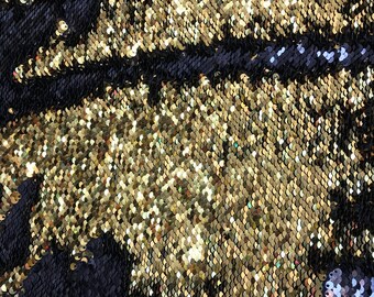 Black/gold flip up sequins reversible sequins on spandex base 2way stretch 58/60&quot; Sold by the YD. Ships worldwide from Los Angeles CA USA.