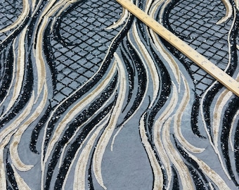 New Luxury abstract design embroidery on stretch mesh 2-way stretch 55/57” Sold by the YD. Ships Worldwide from Los Angeles California USA.