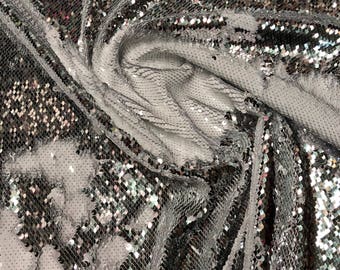 New flip up sequins reversible sequins White/silver spandex base 2way strech 58/60&quot; Sold by the YD. Ships worldwide from Los Angeles CA USA