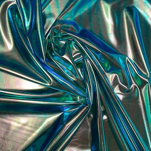 New blue green iridescent foil metallic spandex foil 4way stretch 58/60&quot; Sold by the YD. Ships worldwide from Los Angeles California USA.
