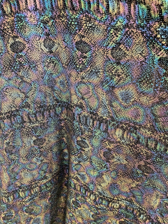 New iridescent snake design black/pink metallic spandex 4 way stretch 58/60” Sold by the YD. Ships worldwide from Los Angeles California USA
