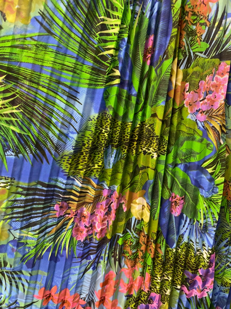 Ships worldwide from Los Angeles CA USA. New Hiding Exotic Leopard design print on pleated power mesh 4-way stretch 5860\u201d Sold by the YD