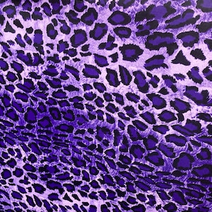 Exotic leopard design purple/black print on nylon spandex 4-way stretch 58/60” Sold by the YD. Ships worldwide from Los Angeles California