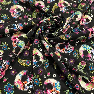 Skulls and paisley design Black/Multicolor print on best quality of nylon spandex 4-way stretch 58/60” Sold by the YD.