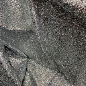 New denim fabric non stretch with silver metallic glitter all over 58/60&quot; Sold by the YD. Ships worldwide from Los Angeles California USA.