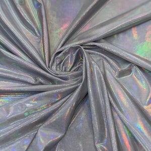 New oil slick iridescent white/silver hologram metallic nylon spandex  4-way stretch 58/60” Sold by the YD. Ships worldwide from L.A