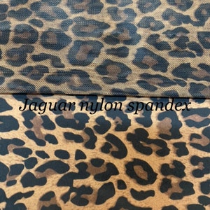 May include: Close-up of two fabric swatches with a leopard print pattern. The top swatch is labeled "Jaguar power mesh" and the bottom swatch is labeled "Jaguar nylon spandex".