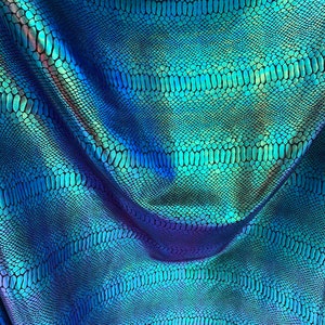 New Iridescent snake foil 2 tone blue/green metallic nylon spandex 4way stretch 58/60" Sold by the  YD. Ships worldwide from Los Angeles CA.