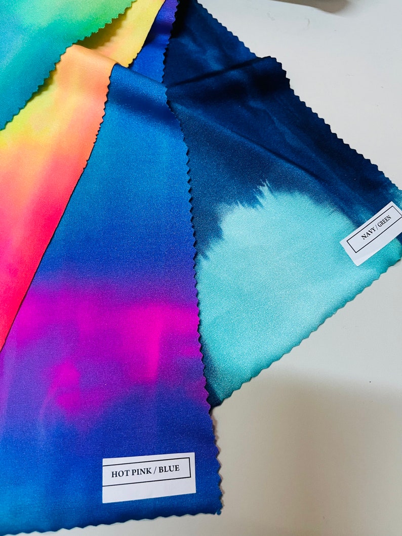 May include: Four fabric swatches with tie-dye patterns in different colors. The swatches are labeled "HOT PINK/BLUE" and "NAVY/GREEN".