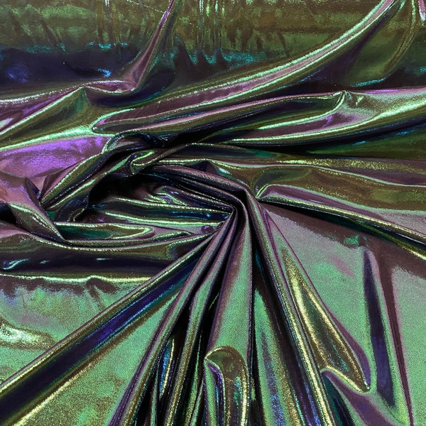 New oil slick iridescent blue green hologram metallic nylon spandex  4-way stretch 58/60” Sold by the YD. Ships worldwide from L.A