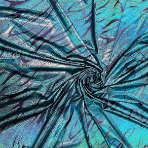 New Exotic animal print hologram metallic nylon llorar spandex 4-way stretch 58/60” Sold by the YD. Ships worldwide from L.A