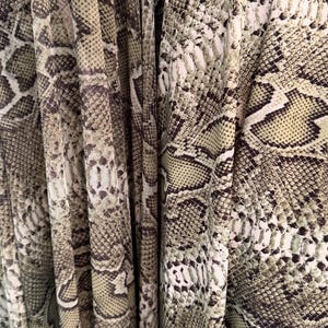 New Python Snake design Olive/Green print on heavy weight nylon spandex and power mesh nylon spandex  4way stretch  58/60" Sold by the YD.