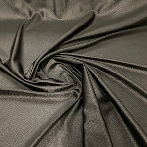 Dragon skin jumbo embossed great quality of nylon spandex 4-way stretch 58/60” Sold by the YD. Ships worldwide from Los Angeles California