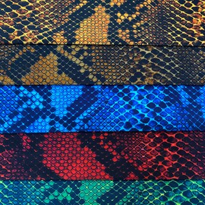 May include: Five fabric swatches with a snake skin pattern. The swatches are in the colours brown, blue, red, green, and black.
