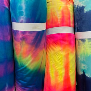 Tie dye Luxury shiny nylon spandex 4-way stretch 58/60” Sold by the YD. Ships Worldwide from Los Angeles California USA.