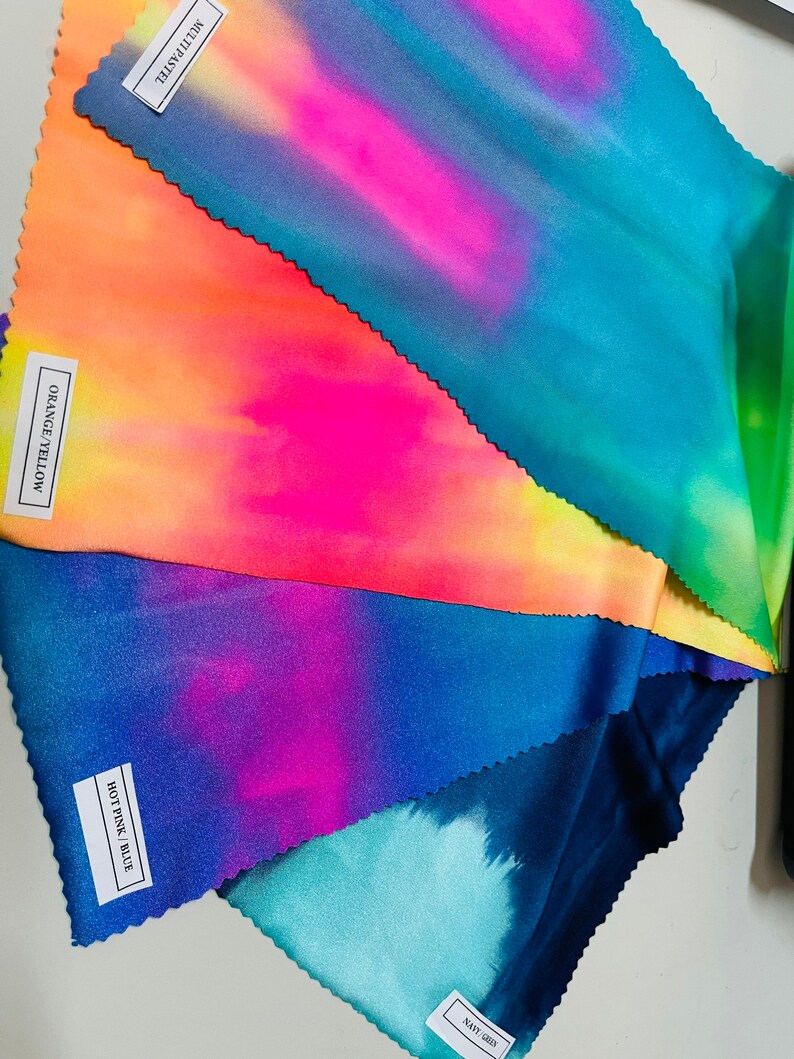 May include: Five fabric swatches in different tie-dye patterns. The swatches are labeled "Navy Green", "Hot Pink Blue", "Orange/Yellow", and "Multi Pastel".