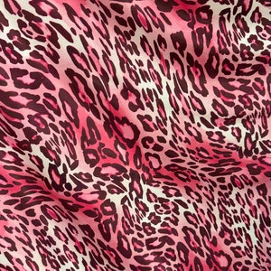 May include: Pink and brown leopard print fabric with a satin finish.