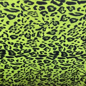 Exotic leopard design print on nylon spandex 4-way stretch Green /black 58/60” Sold by the YD. Ships Worldwide from Los Angeles California