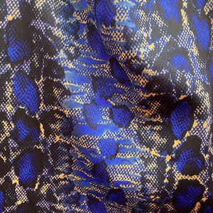 New poly spandex snake design medium weight 2-way stretch taupe/sapphire 58/60” Sold by the YD. Ships worldwide from Los Angeles California