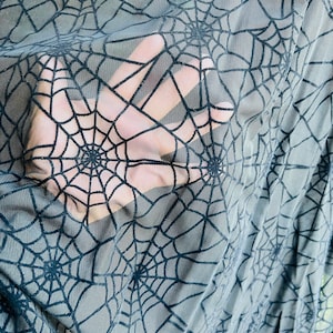 Spiderweb design nylon power mesh with flocking 4-way stretch 58/60” Sold by the YD. Ships Worldwide from Los Ángeles California USA.