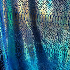 New iridescent metallic nylon spandex dragon design 4way stretch 58/60&quot; Sold by the YD. Ships worldwide from Los Angeles California USA.