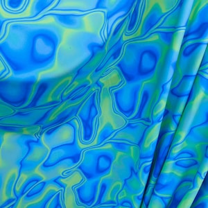 New abstract lava design Purple/blue/green print on best quality of nylon spandex 4-way stretch 58/60” Sold by the YD. Ships Worldwide