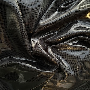 Dragón scales design super shiny stretch velvet with foil 4-way stretch 58/60” Sold by the YD. Ships Worldwide from Los Angeles California