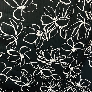 Orchid design Black/White print on great quality of nylon spandex 4-way stretch 58/60” Sold by the YD. Ships worldwide from L.A