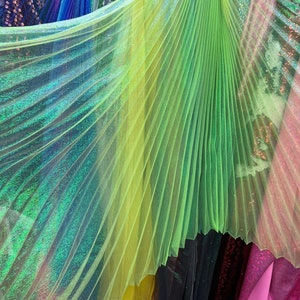Sunburst pleated fabrics iridescent metallic organza 108” length by 56” width Sold by the PC ships worldwide from Los Angeles California USA