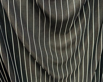 Pin stripes on nylon spandex 4-way stretch 58/60” Sold by the YD. Ships worldwide from Los Angeles California USA.