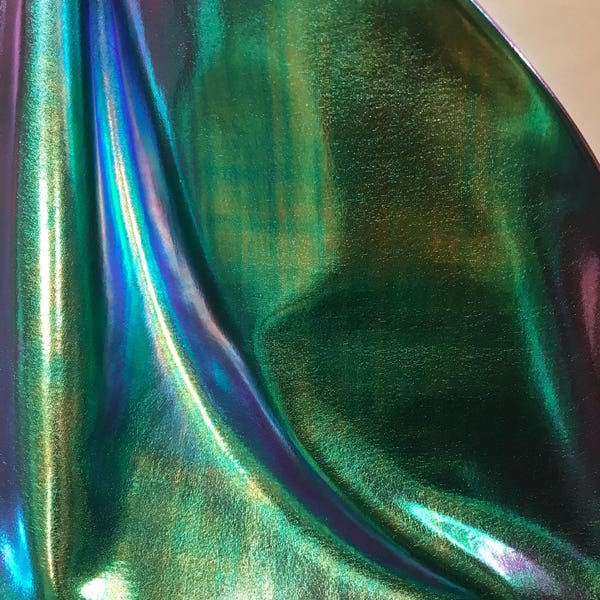 New Iridescent all over foil blue/green nylon spandex 4way Stretch 58/60" Sold by the YD. Ships worldwide from Los Angeles California USA