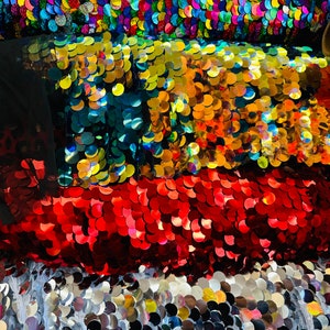 Luxury shiny paillette sequins embroidered on stretch mesh 2-way stretch 58/60” Sold by the YD. Ships worldwide from Los Angeles California