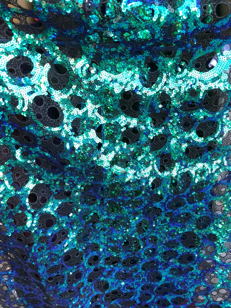 New lace with sequins oval design iridescent peacock color non Stretch 5052 Sold by ghe YD Ships worldwide from Los \u00c1ngeles CA USA