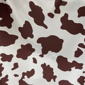 Cow design white/brown print on great quality of nylon spandex 4-way stretch 58/60” Sold by the YD. Ships Worldwide from Los Angeles Califor
