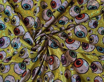 NEW Abstract Eyeballs design on hologram shattered glass metallic nylon spandex 4-way stretch 58/60” Sold by the YD.