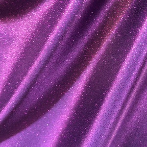 New Selana design poly spandex with glitter eggplant/purple 4way stretch 58/60&quot; Sold by the YD. Ships worldwide from Los Angeles CA USA.